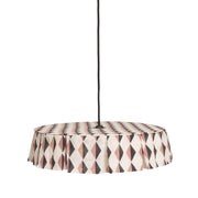 Nobodinoz Vibes katoenen lampenkap van 50 cm in roodbruin-zwart harlekijn tegen een lichte, warme achtergrond.
